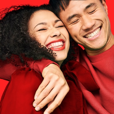 Couple smiling and hugging